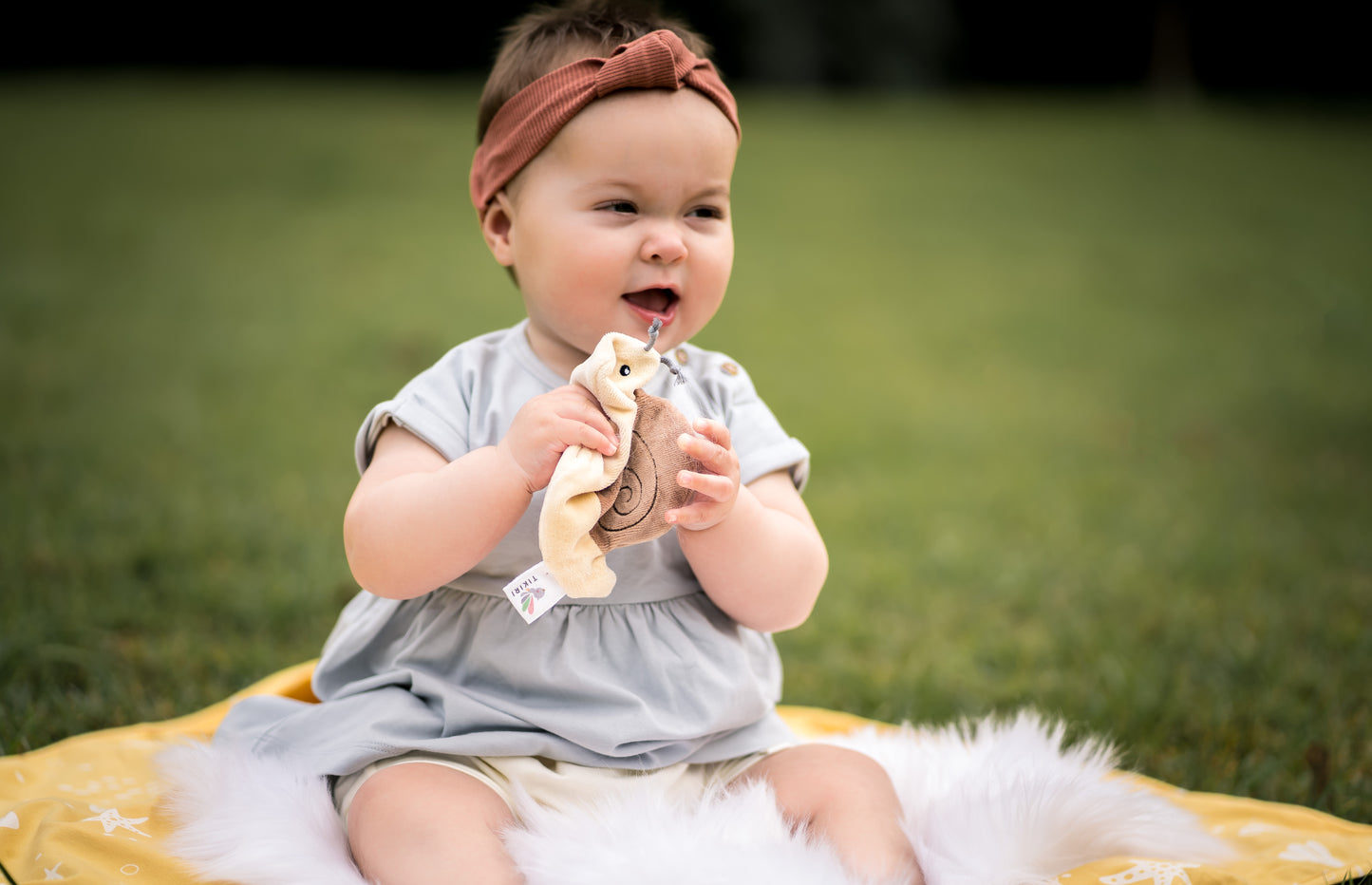 Baby playing with the snail crinkle toy