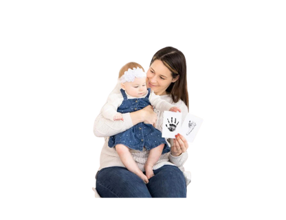 Baby and mom after using the  inkpads showing a job well done.