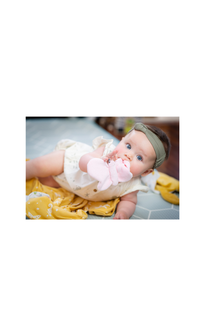 Baby playing with butterfly crinkle toy