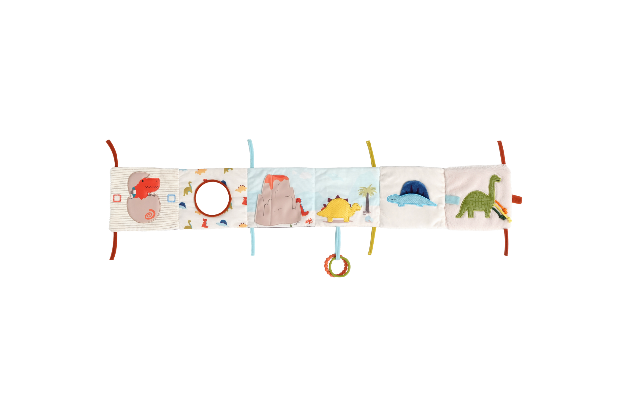 The Dino soft book spread open to expose different pictures and a mirror