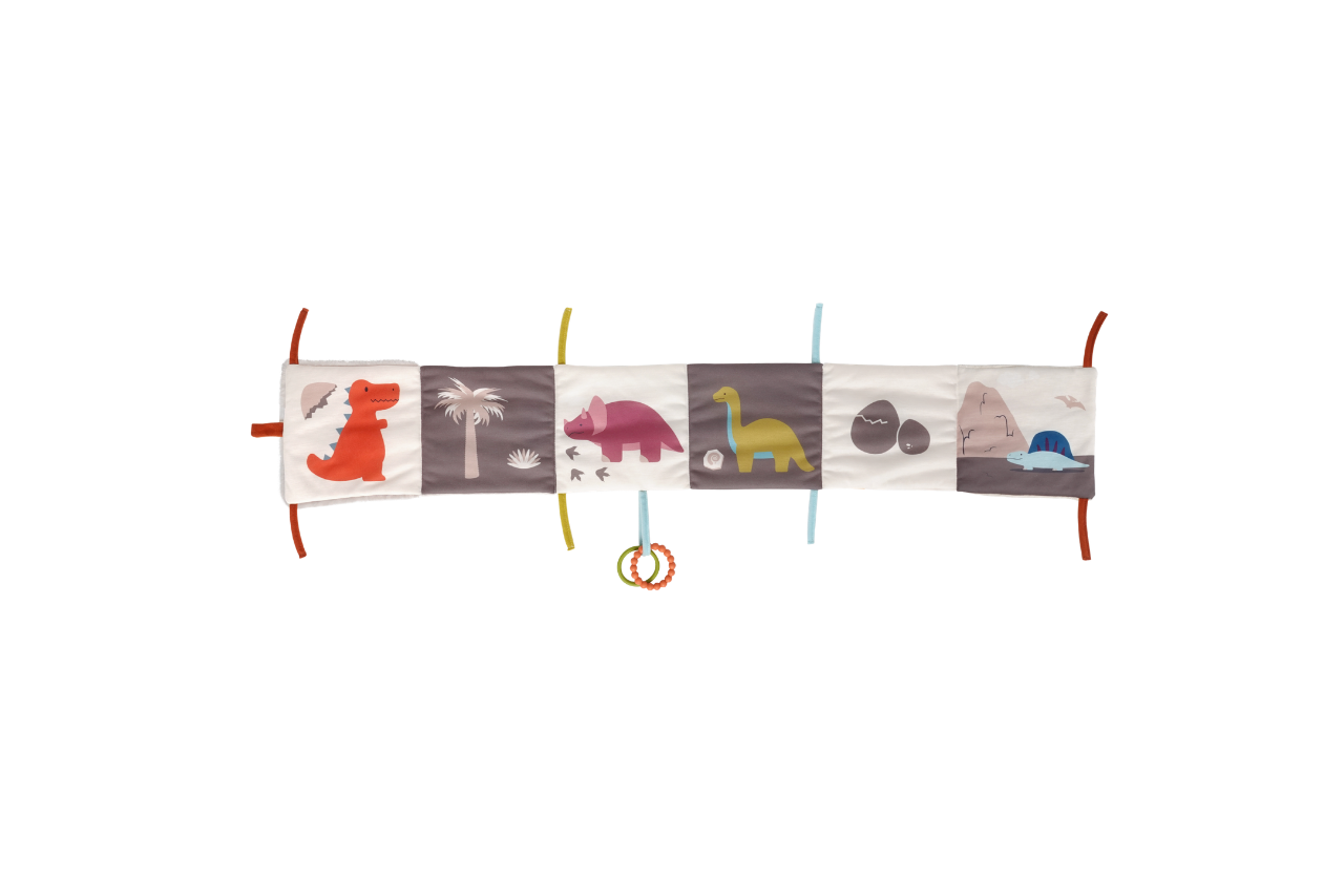 Dino soft book spread out to show a different side of the book with more pictures and teething rings