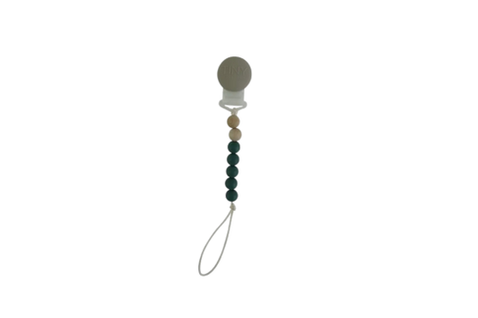 Tiny Teethers mini pacifier clip is perfect for the mini in your life. This innovative silicone clip is designed with a few moving parts and no metals. This allows your baby to teethe on the clip itself unlike the metal ones. Designed with fewer medium weight beads, our pacifier clip won't pull the soother out of your little baby's mouth. It will also stay clipped to your baby's clothing, preventing you from losing the soother or having it fall to the ground and get dirty in the moment you need it most.