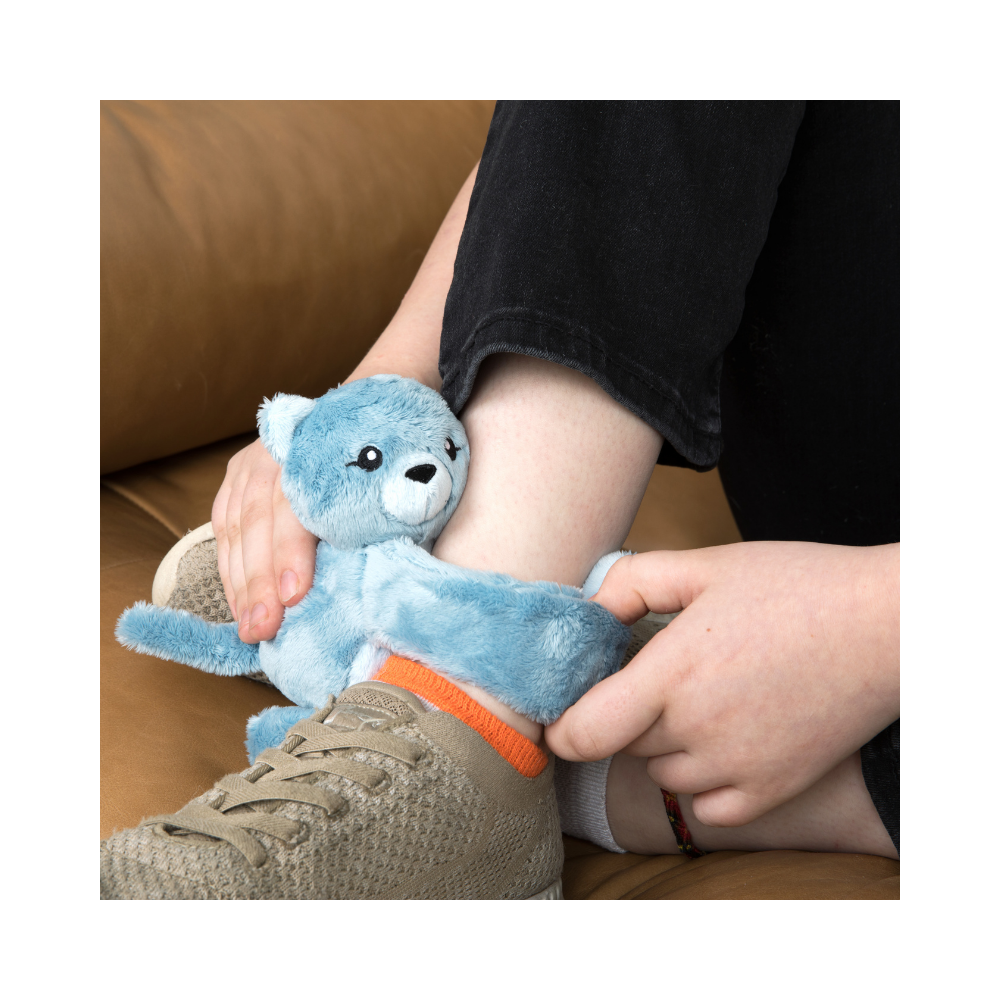 Frankie the Cat wrapped around a kid's ankle