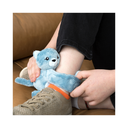 Frankie the Cat wrapped around a kid's ankle