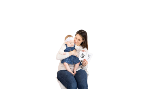 Baby & mom holding  pictures of imprints done