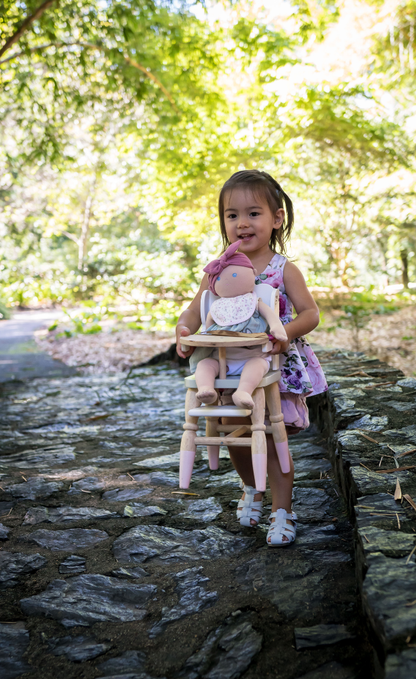 Little girl playing with Baby Kaia