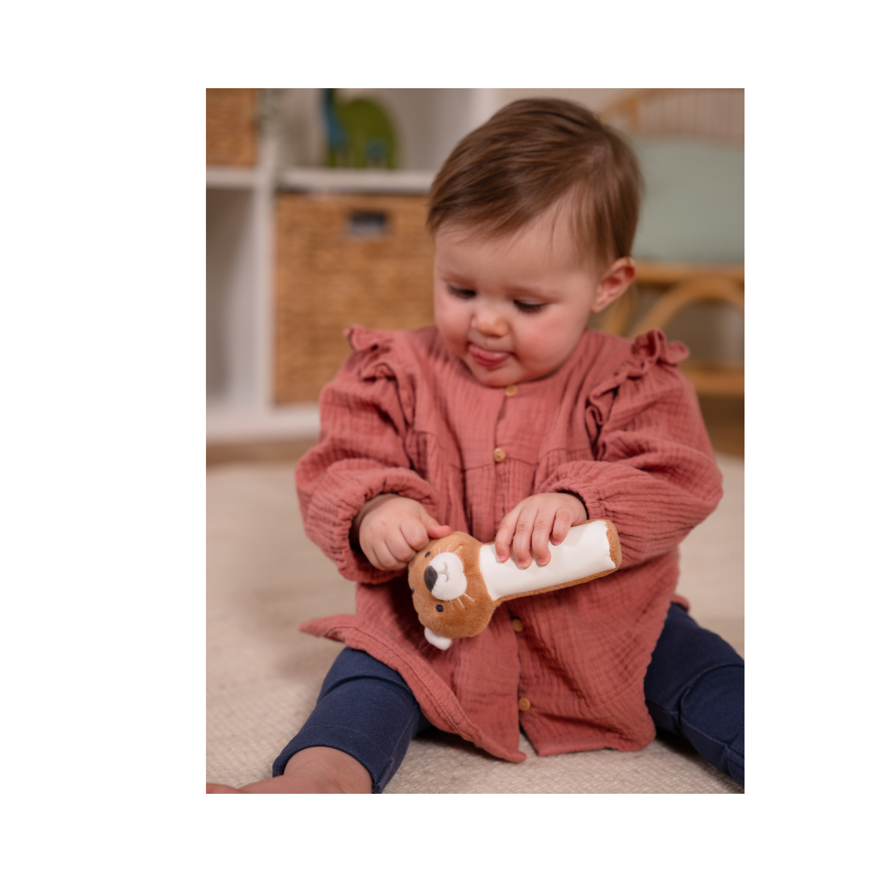 Baby playing with Tim the Tiger