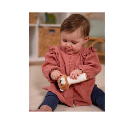 Baby playing with Tim the Tiger