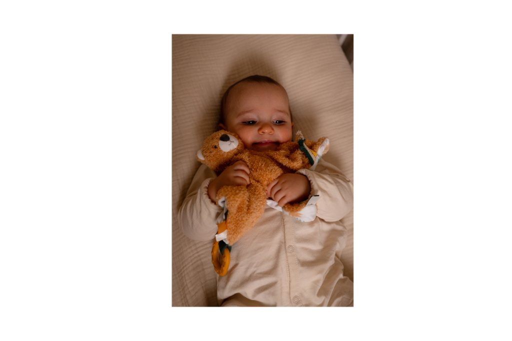 Baby playing with Tim The Tiger baby comforter