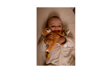 Baby playing with Tim The Tiger baby comforter